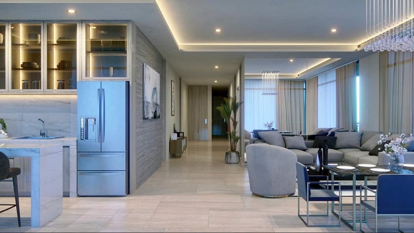 Departamento con nevera doble puerta y mesa de comedor junto al sofá en Distrito Morelos