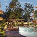 Piscina jardín y solarium rodeado de edificio residencial en Nativa Tulum