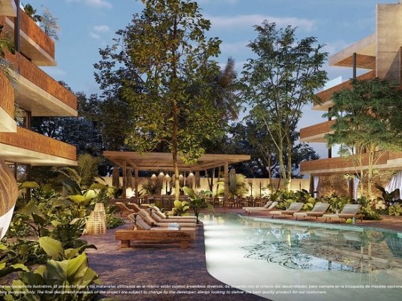 Piscina jardín y solarium rodeado de edificio residencial en Nativa Tulum