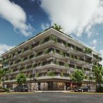 Coin d'un immeuble résidentiel blanc avec végétation au centre-ville de Sensai
