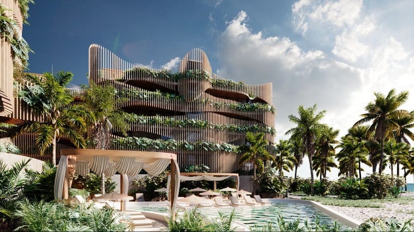 Edificio residencial con elementos verdes y piscina en el jardín de palmeras con vista al mar en Maiim Oceanfront Living