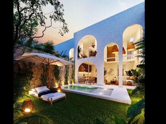 Jardín de la piscina de una casa durante la noche en Domum Tulum