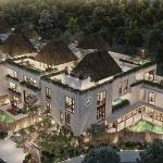 Vue de dessus de l'immeuble résidentiel avec des palapas sur les toits et une piscine au rez-de-chaussée à Mestiza Tulum