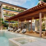 Swimming Pool and swings hanging under pergola at Nygma Tulum