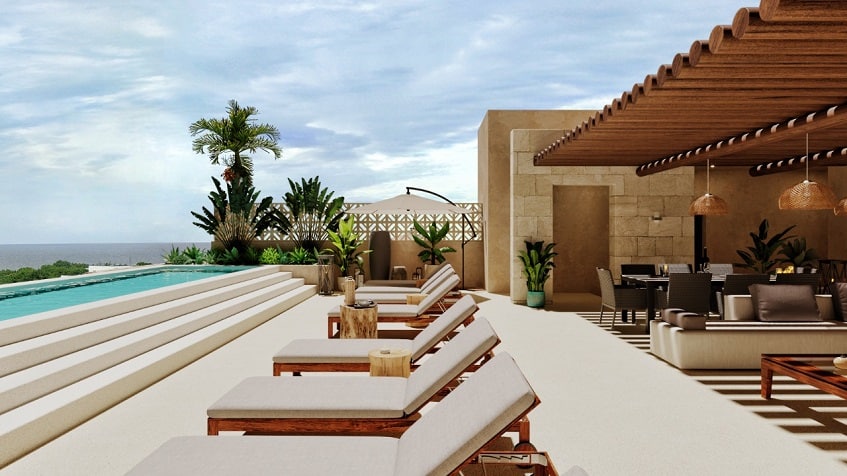 Roof garden con alberca larga, solárium y área lounge en Porto Blu Puerto Morelos