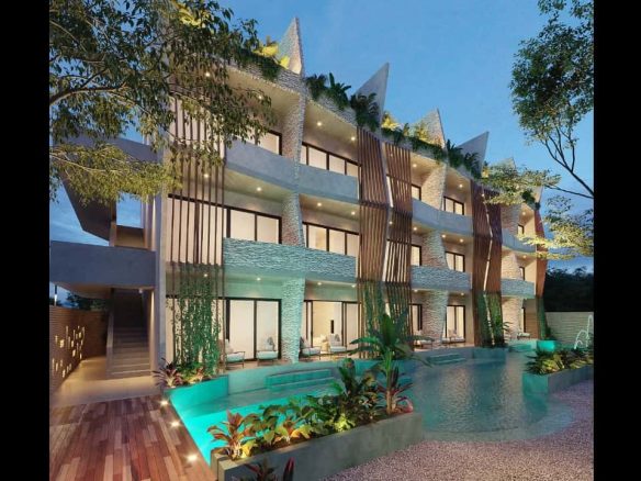 Fachada de edificio residencial, piscina y entrada con escalera en Kanah Tulum