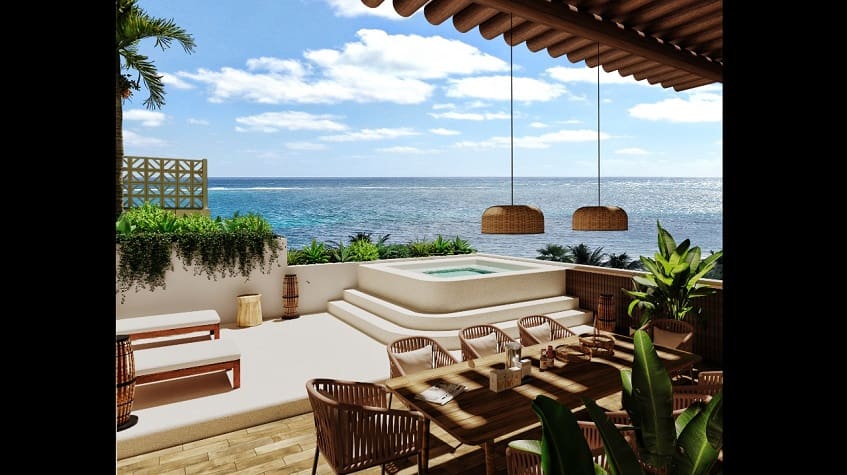 Pequeño jacuzzi en una gran terraza con vista al mar en Porto Blu Puerto Morelos