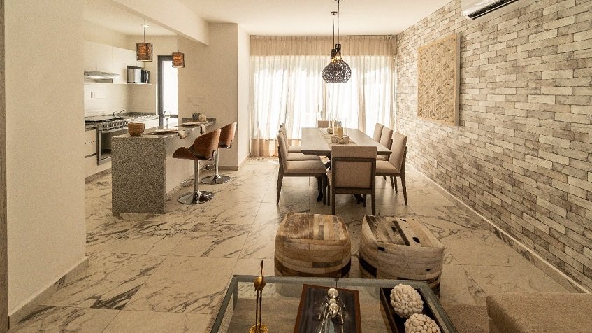 Large dining table and kitchen at Recinto House | Bali in Riviera Maya