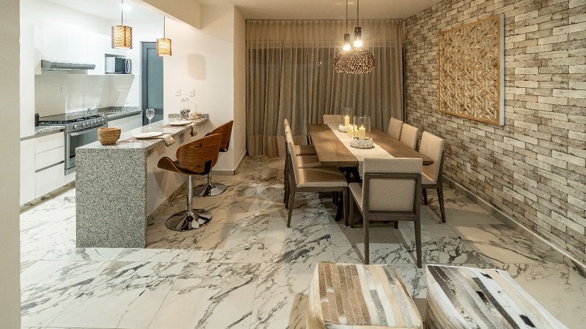 Large dining table and kitchen at Recinto House | Bali in Riviera Maya