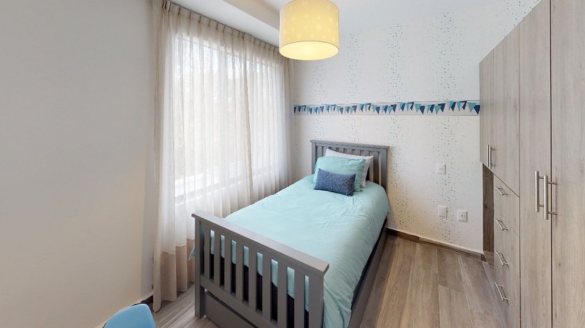 Bedroom with small bed and large closet in Recinto House | Bali in Riviera Maya