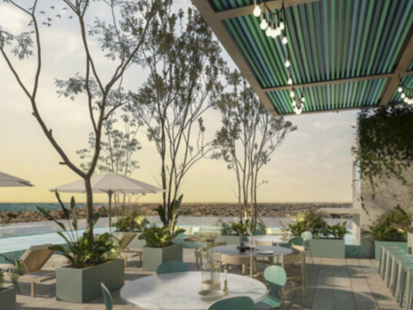 Restaurant et bar à côté d'une piscine entourée de végétation à Altra Beach Condos