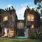Fachada de edificio residencial redondo con escaleras en el medio, alberca, terraza, hamaca en Esencia Villas Tulum
