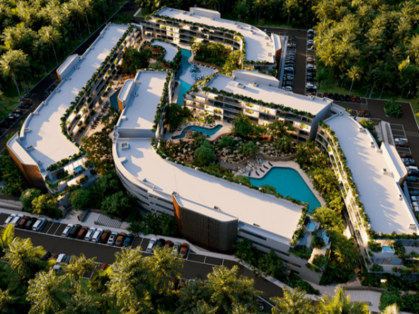 Vista superior de edificios residenciales, piscinas y jardín, calle en The Leaf Condos Playacar