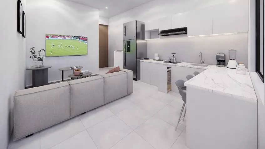 Large white kitchen corner, white sofa in front of TV screen in South 307 Condominiums