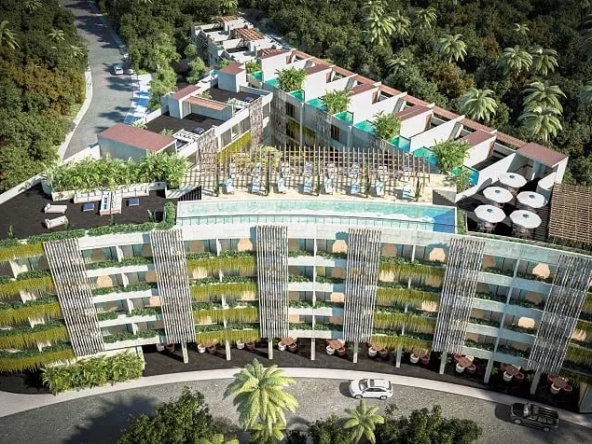 Conjunto residencial en forma de triángulo, balcones verdes, azoteas de piscinas en Macondo Hotel and Residences Tulum