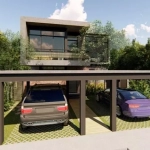 Fachada de casa y estacionamiento con dos autos estacionados en Casa Mayakoba