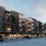 Edificio residencial con negocios comerciales en planta baja por una calle, árboles individuales en Town Center Zama Tulum