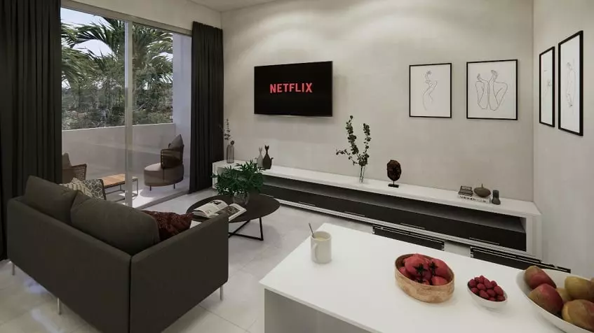 Living room with sofa in front of the TV screen, terrace in Sur 307 Condominiums