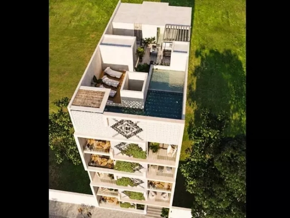 Vista aérea de edificio residencial con azotea y balcones en Johannes Condos Playa del Carmen