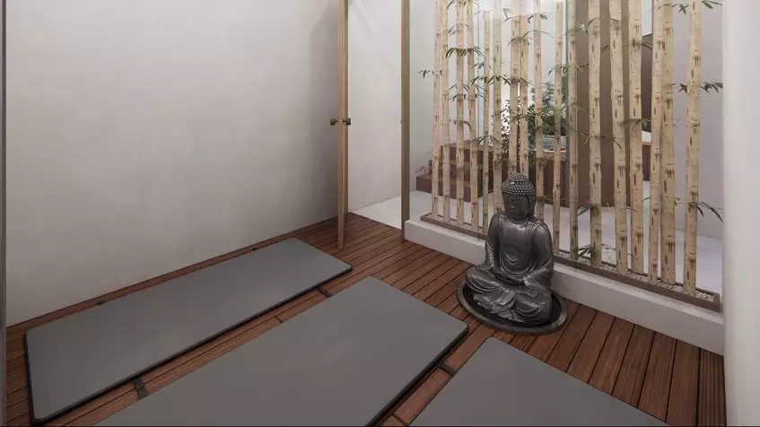 Yoga room with yoga mats and Buddha statue in South 307 Condominiums