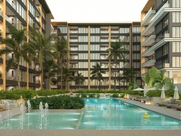 Splash pool y piscina rodeada de sombrillas, camastros y palmeras, edificio residencial en Origin by Wolf Cancun