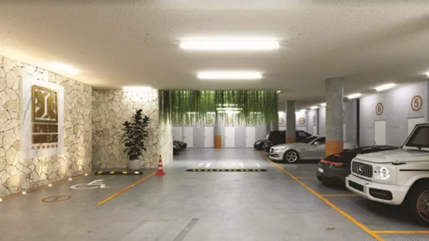 Estacionamiento subterráneo con autos en Ix Puerto Morelos Condos
