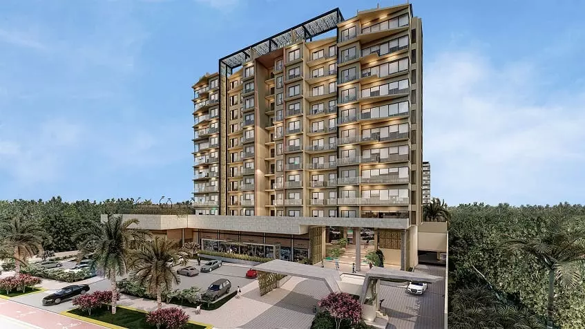 Point de contrôle de sécurité et parking devant un immeuble résidentiel à Valle Aurora Cancún.