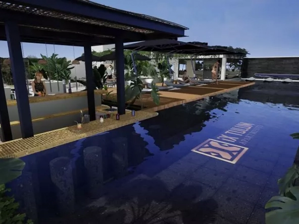Gran piscina con bar bajo pérgola en Ix Tulum Apartments