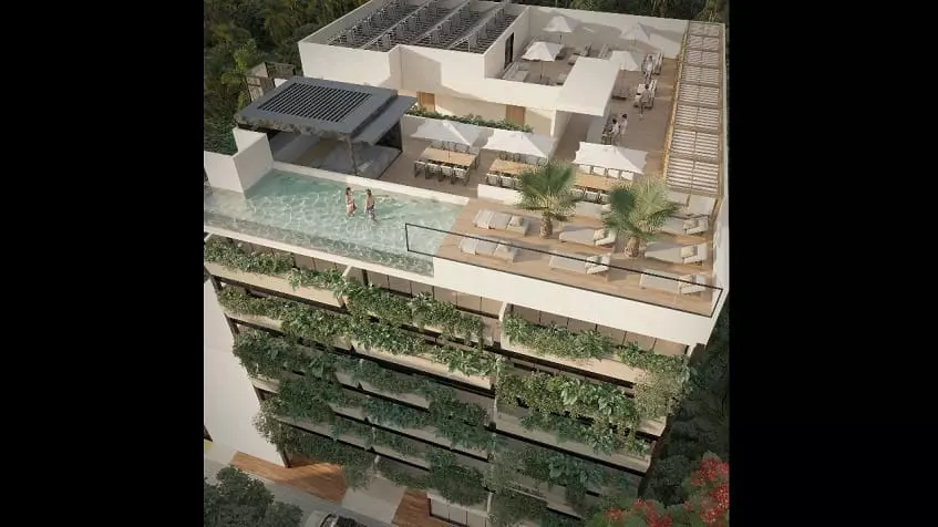 Edificio residencial con piscina en la azotea, balcones verdes y solárium en Isabella Condos