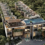 Vue aérienne d'un quartier résidentiel entouré de jungle, piscine sur le toit des condos Waye