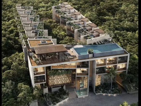 Vista aérea de una zona residencial rodeada de jungla, piscina en la azotea de Waye Condos