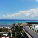View of a rooftop with a pool and ocean at Isabella Condos