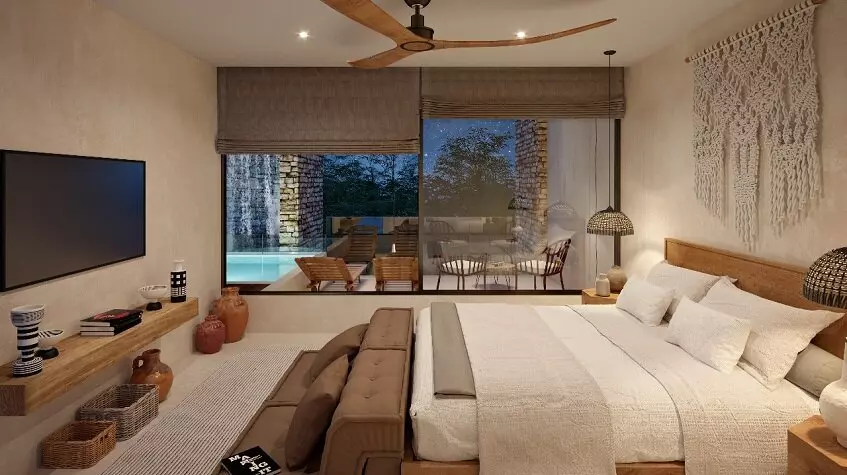 Dormitorio con una cama frente a la pantalla del televisor, terraza de la piscina en Xexen y Xakah