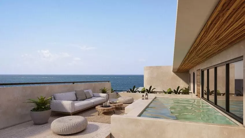 Terraza en la azotea con piscina y lounge en Nalu Puerto Morelos