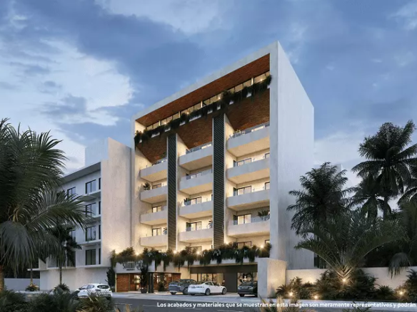 Fachada de edificio residencial blanco con balcones en Studio 34 Playa del Carmen