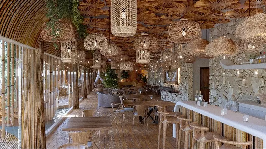 Zona de restaurante y bar decorada con bambú en Kaan Kuja