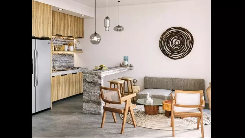 Cocina con desayunador y sofá con mesa ratona y sillas en Torre 48 Playa del Carmen