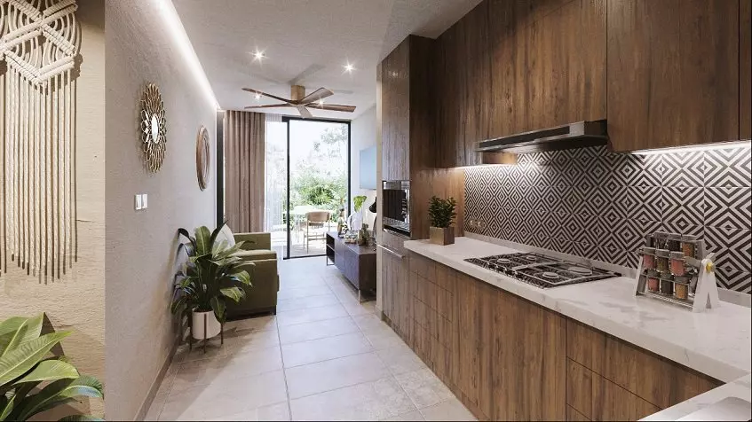 Cocina estrecha y sala de estar con terraza en Ocean Condos Tulum