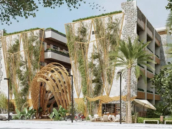 Fachada de edificio residencial con cafetería en la planta baja y entrada principal en Ocean Condos Tulum