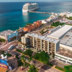 Aerial view of the city and two cruise ships at a dock in Athimar Cozumel