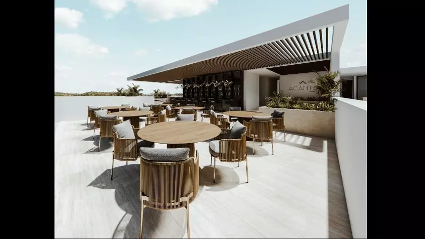 Un bar en una terraza con mesas y sillas en Acanta Telchac Puerto