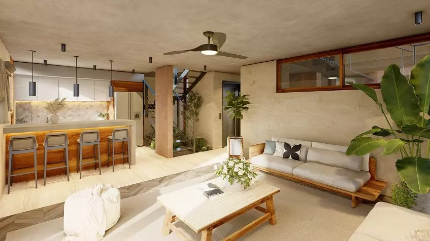 Una sala con cocina integral y escaleras al fondo en Eden Playa del Carmen