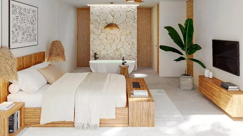 Una recamara, una planta, una tina de baño y una Tv en Noi Tulum