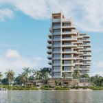 Facade of a building with apartments, a sailboat, and a view of the lagoon in Bao Puerto Morelos