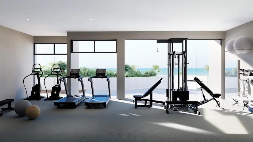Un gimnasio con vista al mar en Sea Lofts Cozumel