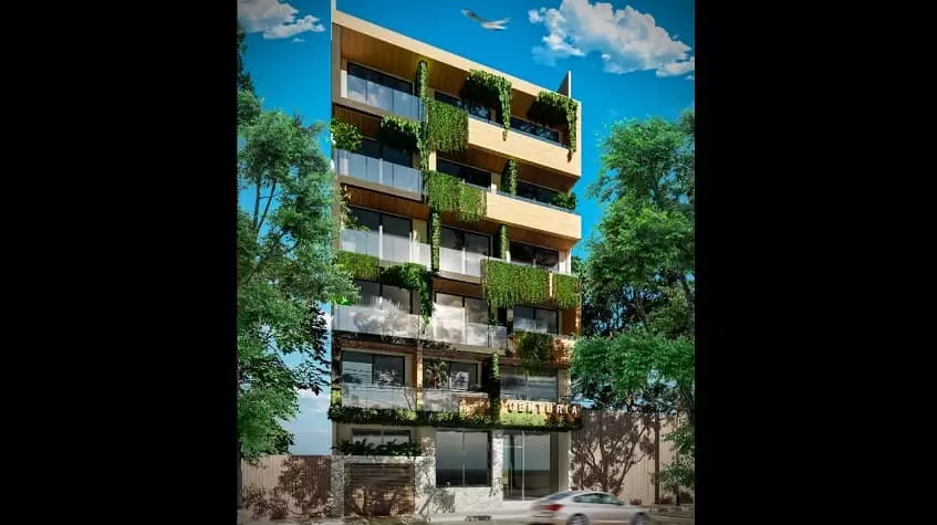 Fachada de edificio con balcones y decoracion natural de plantas en Centuria 25