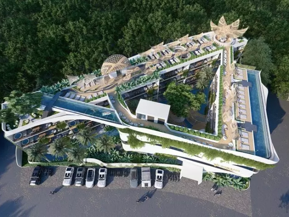 Aerial view of apartments and parked cars in Coralia Tulum