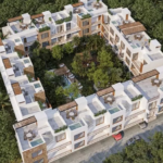 Vue aérienne d'un immeuble résidentiel avec un jardin avec piscine au milieu à Oriana Tulum