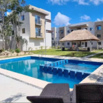 Una alberca, una palapa y 2 camastros en Ciudad Mayakoba
