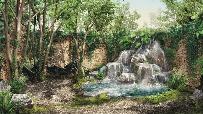 Une cascade avec de grands arbres et 2 hamacs à Adhonai Tulum